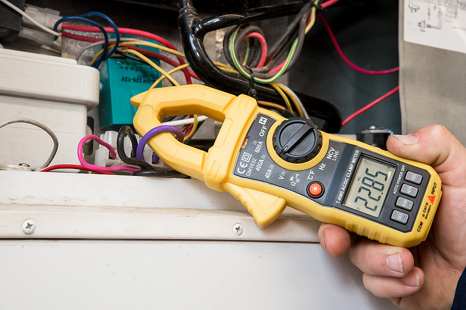 RV Service Centre technician repairing caravan