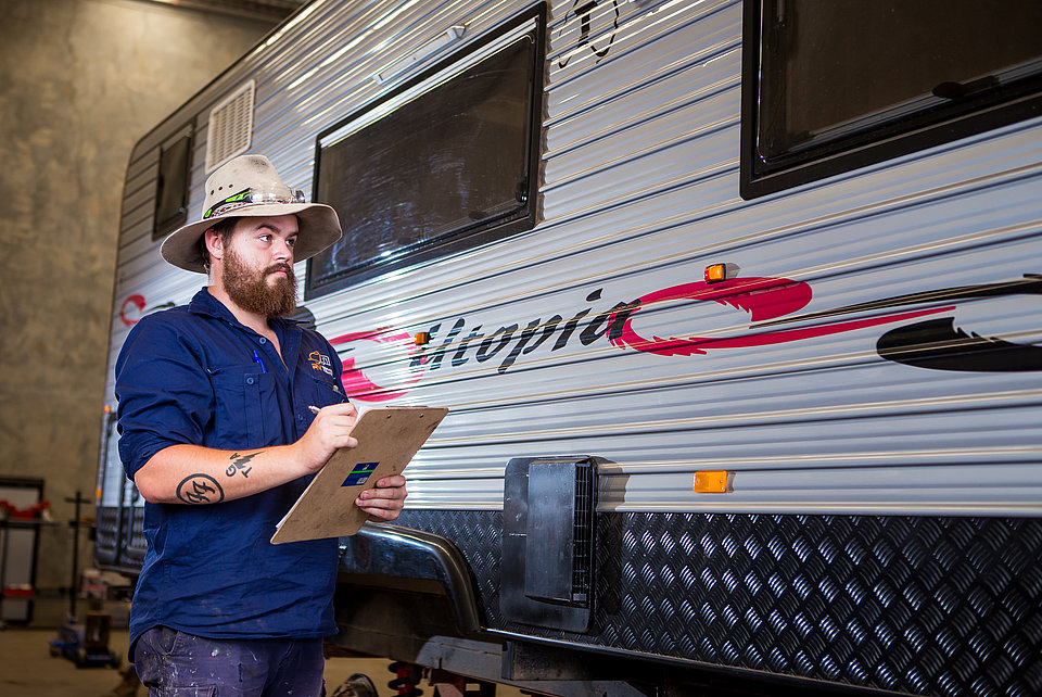 Caravan being serviced by RV Service Centre staff